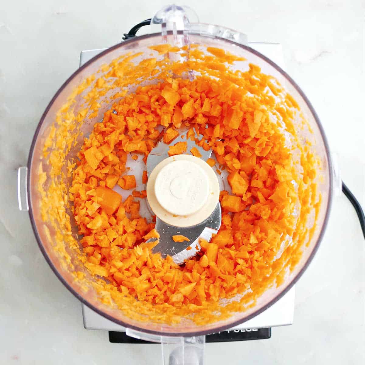Pulsed carrots in a food processor.