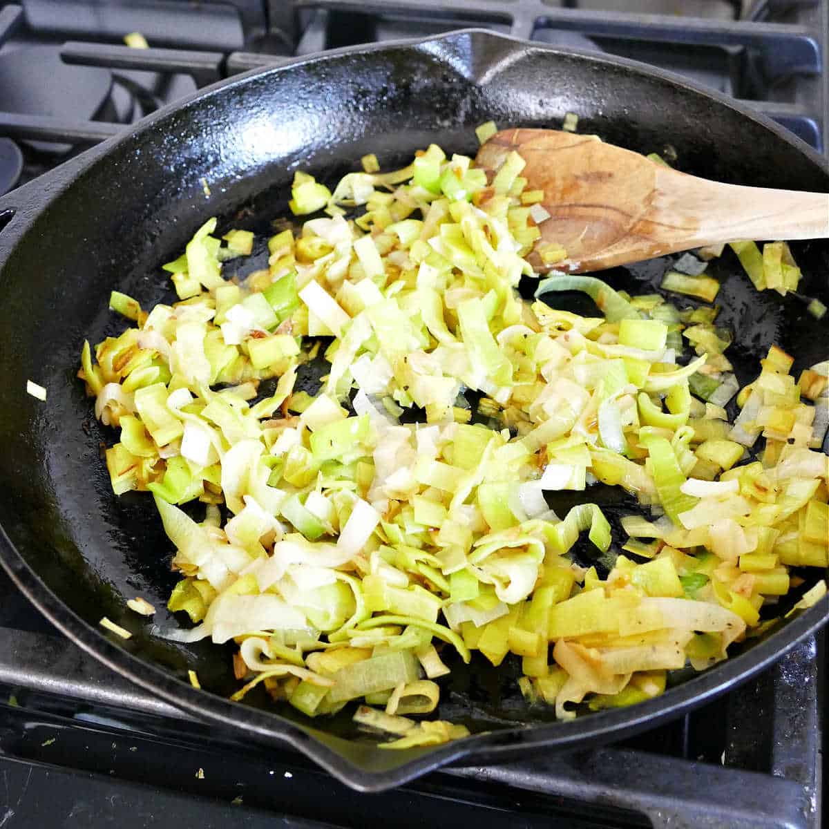 Sauteeing the leeks in a large skillet.