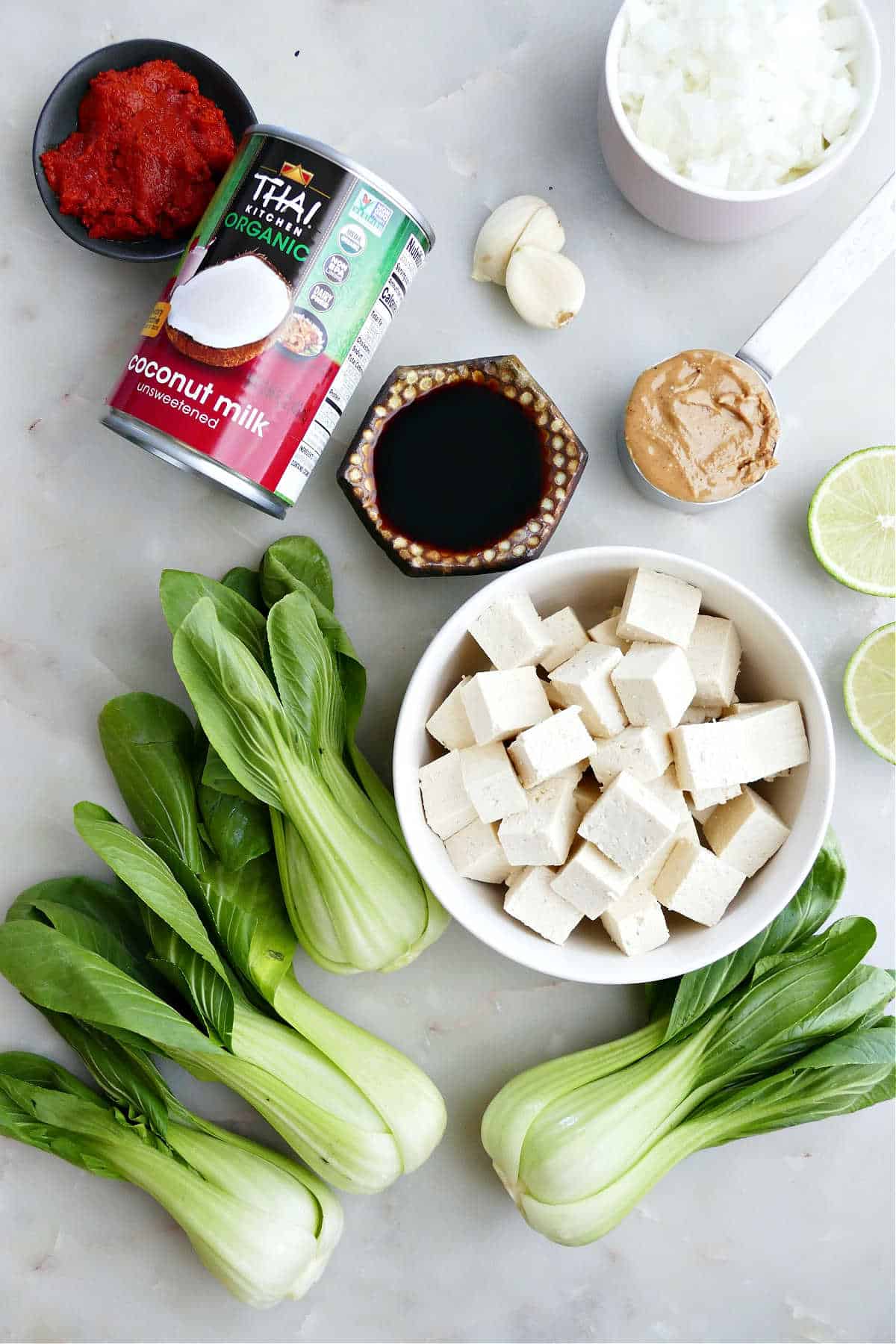 Ingredients needed to make coconut milk tofu and bok choy skillet.