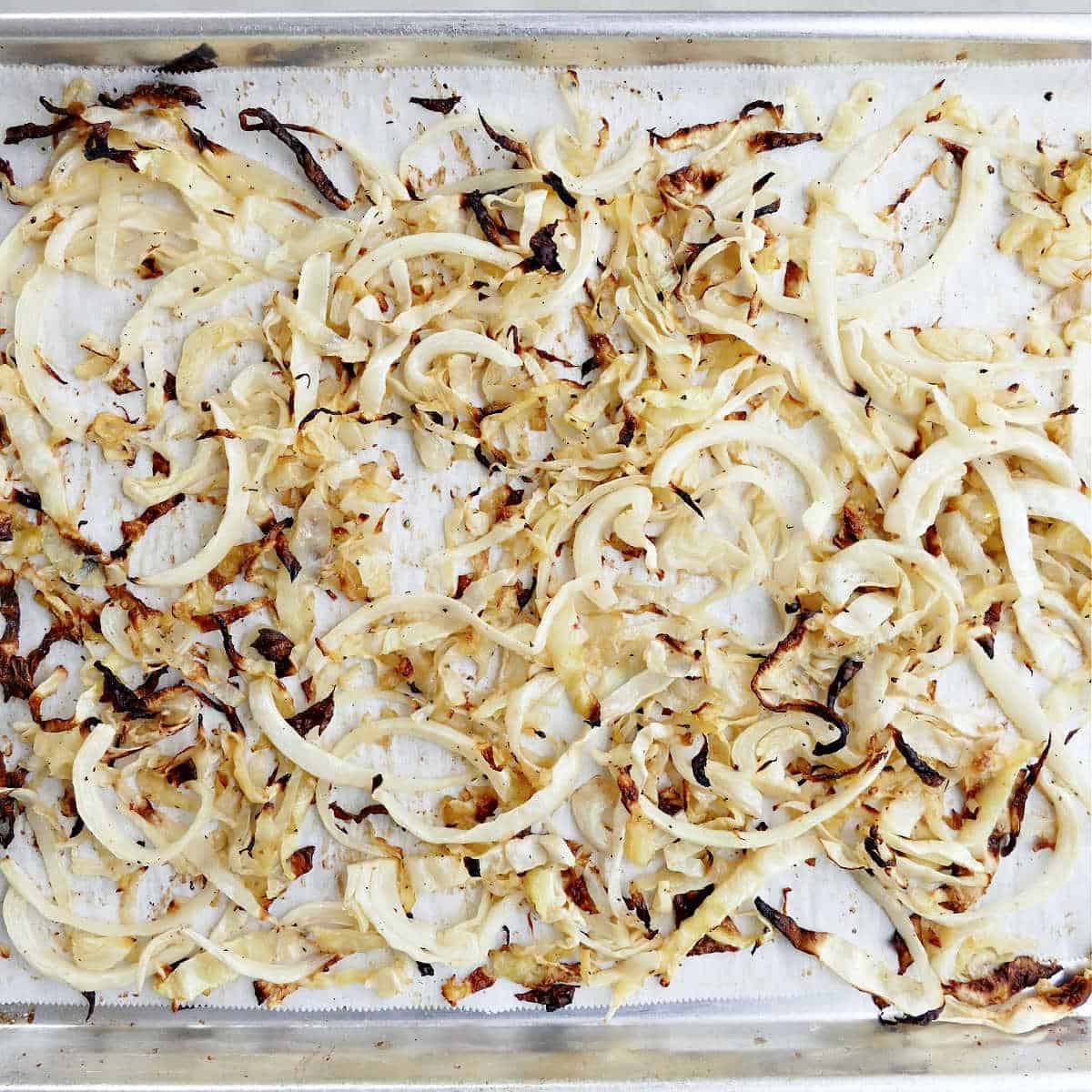 Roasted cabbage on a sheet pan after baking.