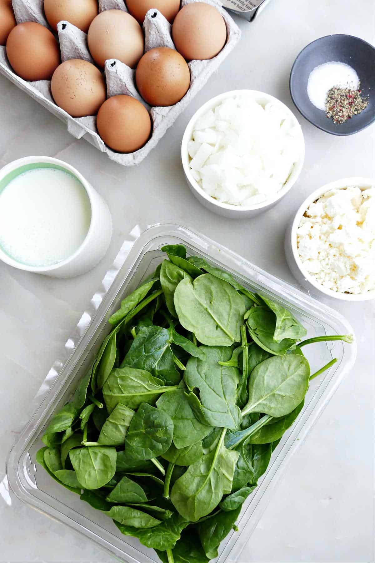 Ingredients needed to make spinach feta egg bake.
