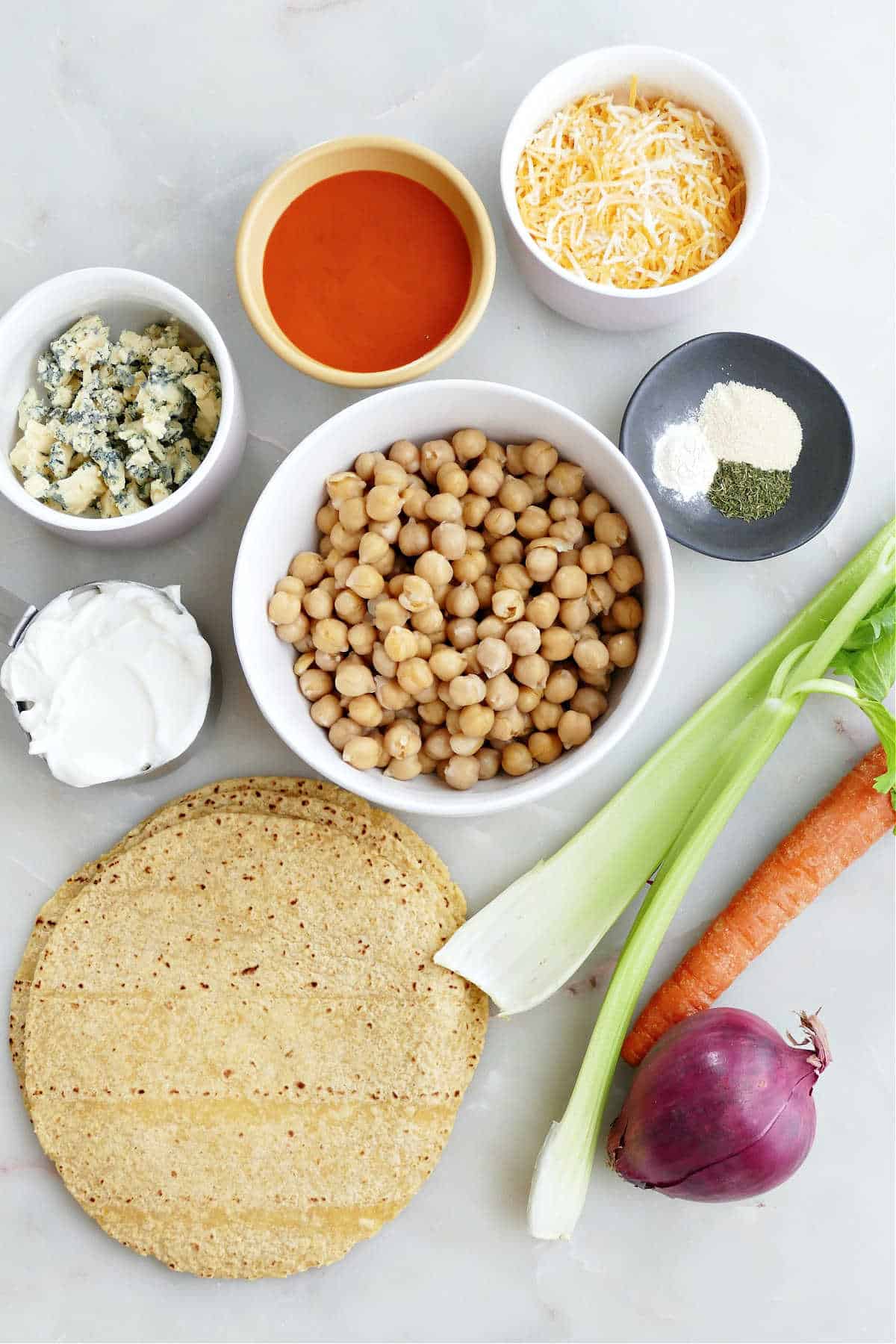 Ingredients needed to make buffalo chickpea tacos.