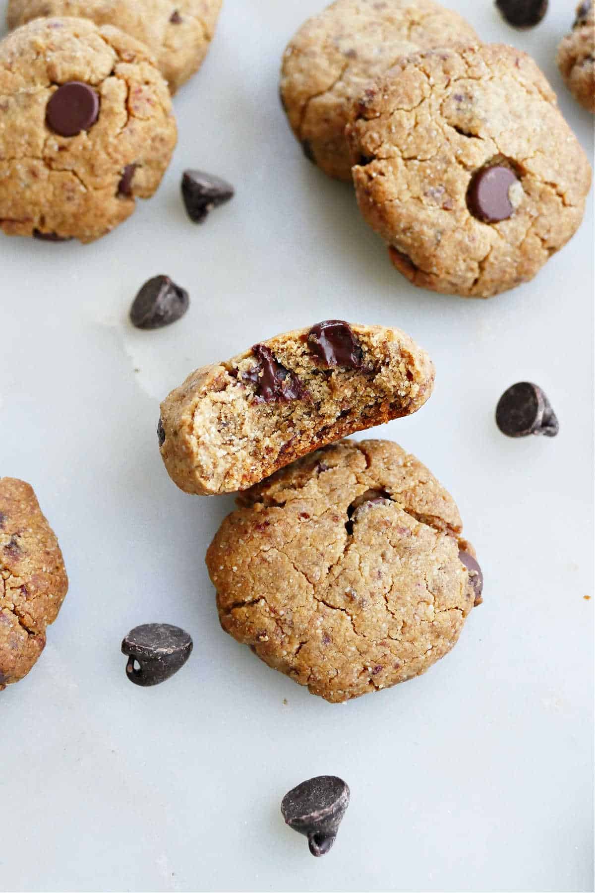 Healthy date cookies, one with a bite taken out.