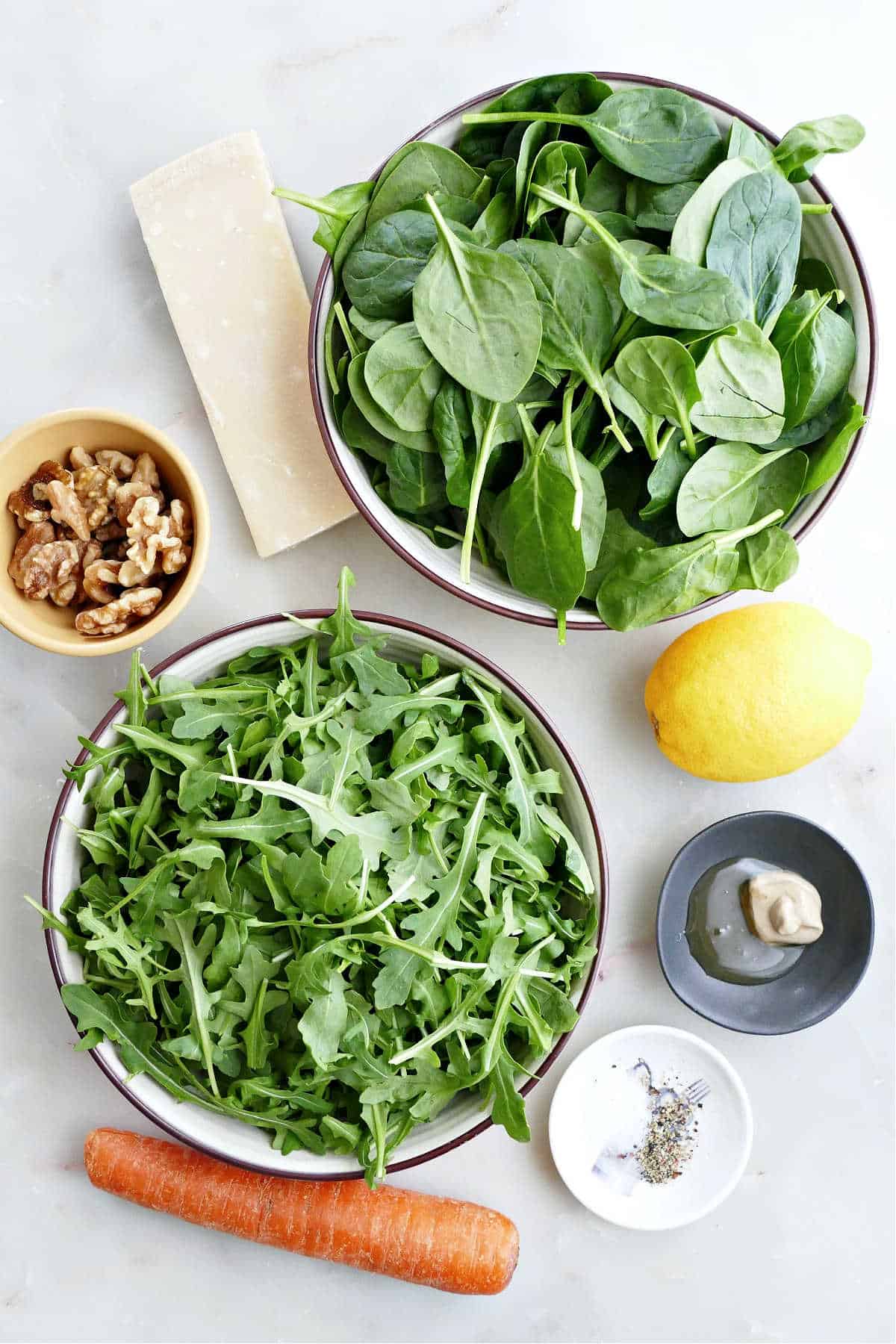 Ingredients needed to make spinach arugula salad.