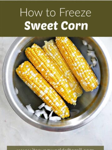 Blanched sweet corn cobs in a bowl of ice water under text box.