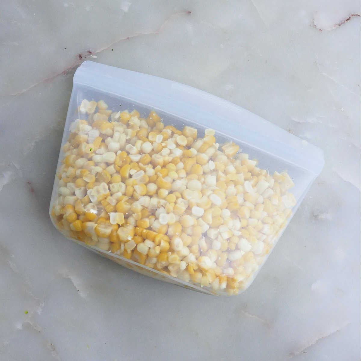 Prepared corn kernels in a silicone bag to be stored in the freezer.