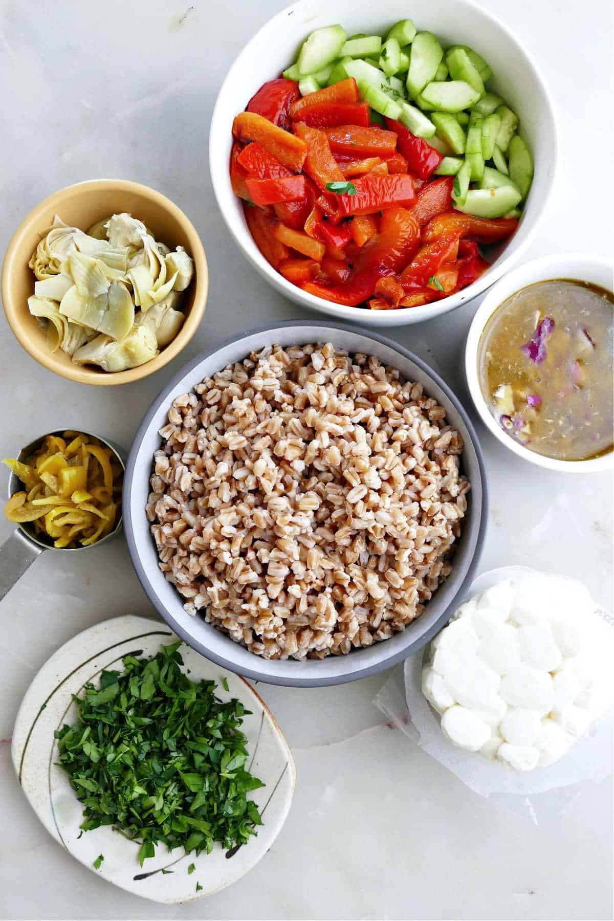 Ingredients needed to make Italian farro salad.