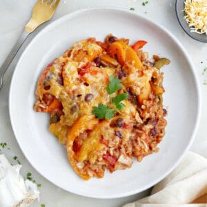 A scoop of unstuffed bell pepper casserole on a white plate.