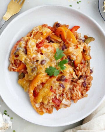 A scoop of unstuffed bell pepper casserole on a white plate.