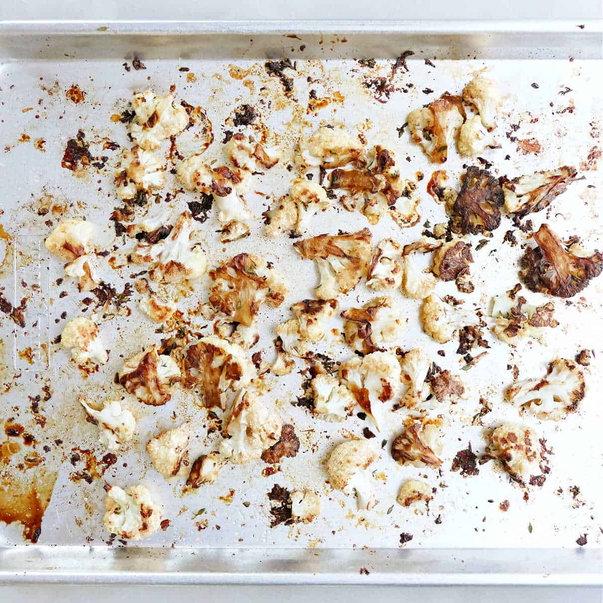 Roasted balsamic cauliflower on a baking sheet.