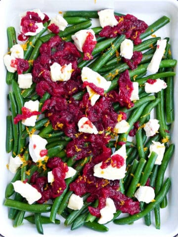 Fresh holiday green beans topped with brie cheese and cranberry suace.