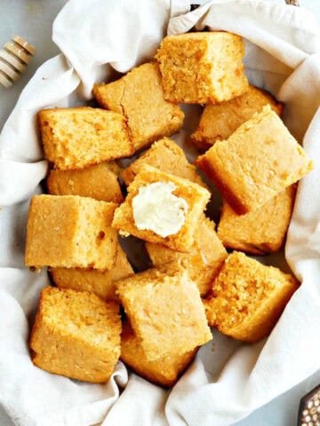 A basket of homemade sweet potato cornbread slices.