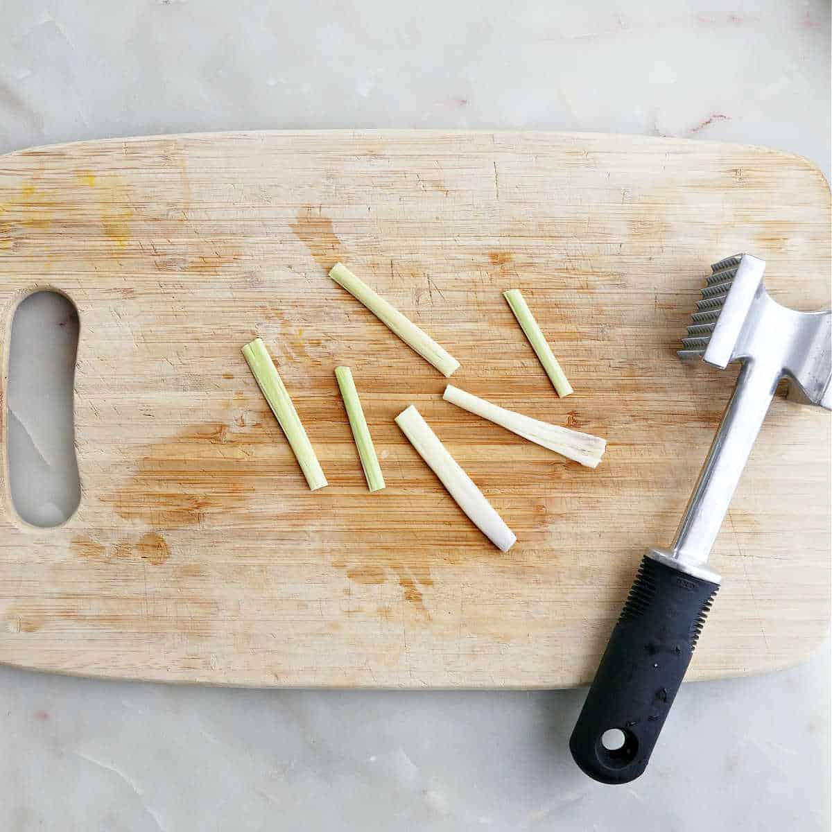 Lemongrass batons smashed open with a meat tenderizer.