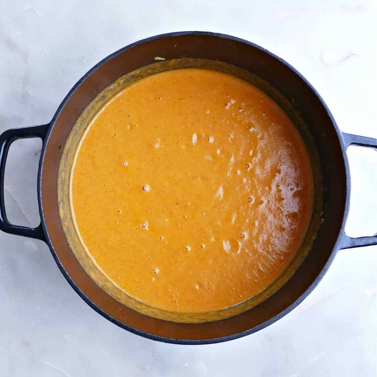 Blended sweet potato and red pepper soup in a large Dutch oven.