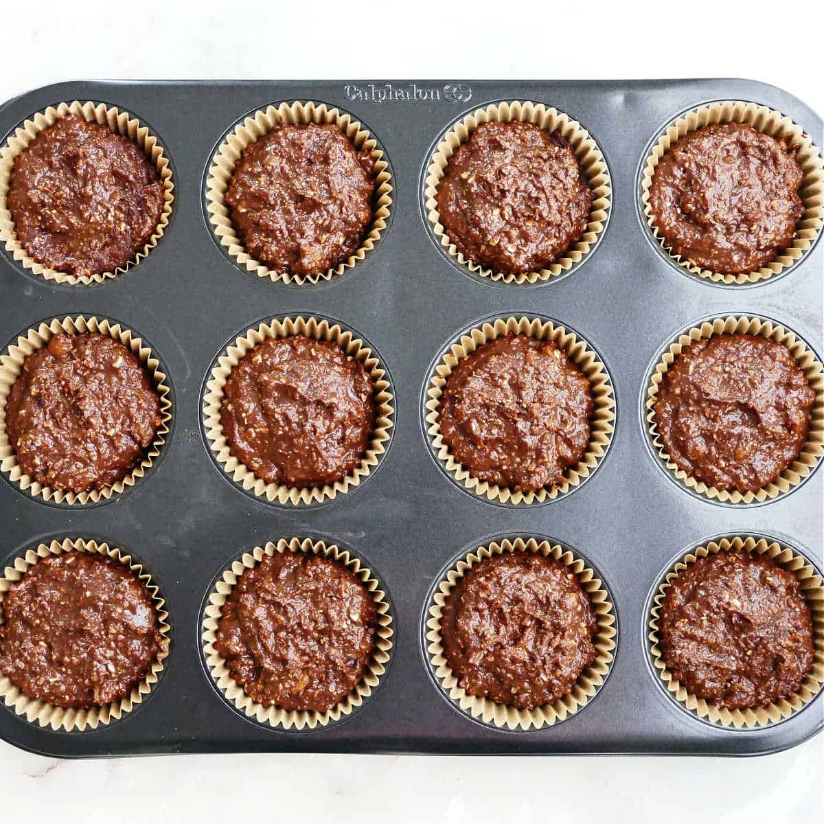 Almond flour chocolate cupcakes in a cupcake tin before baking.