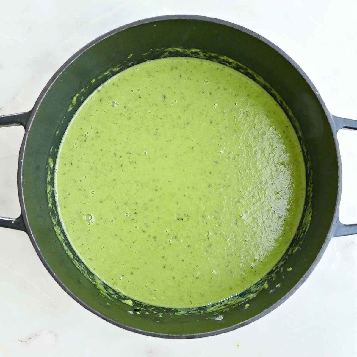 Blended pea and mint soup in a Dutch oven.