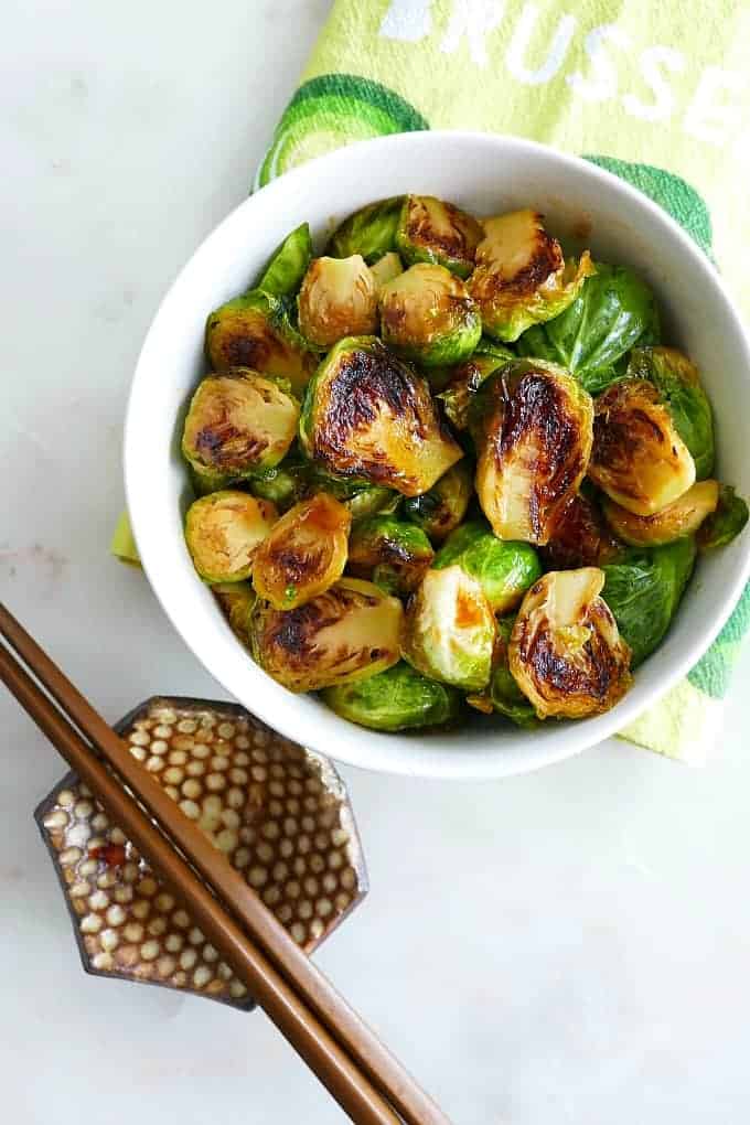 Honey Sriracha Brussels Sprouts in a white bowl. 