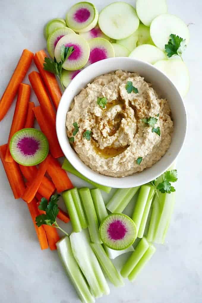 Roasted Turnip Hummus surrounded by veggies.