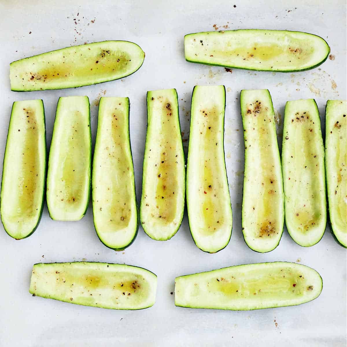 Zucchini sliced and deseeded then briefly roasted on a baking sheet with parchment.