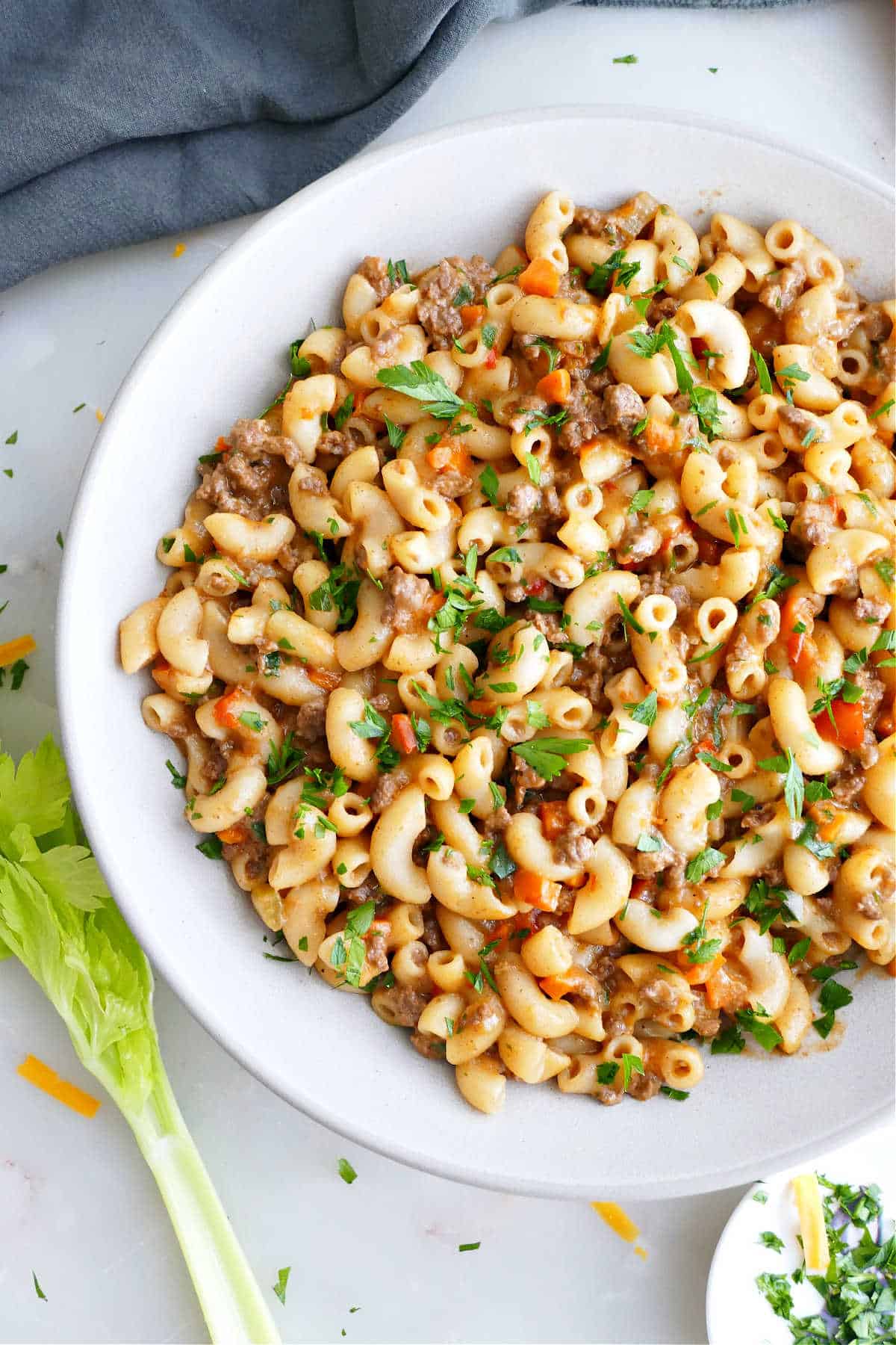 Slow cooker hamburger helper packed with vegetables in a serving bowl.