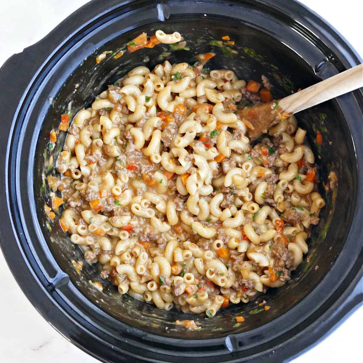 Hamburger helper ready for serving in a slow cooker.