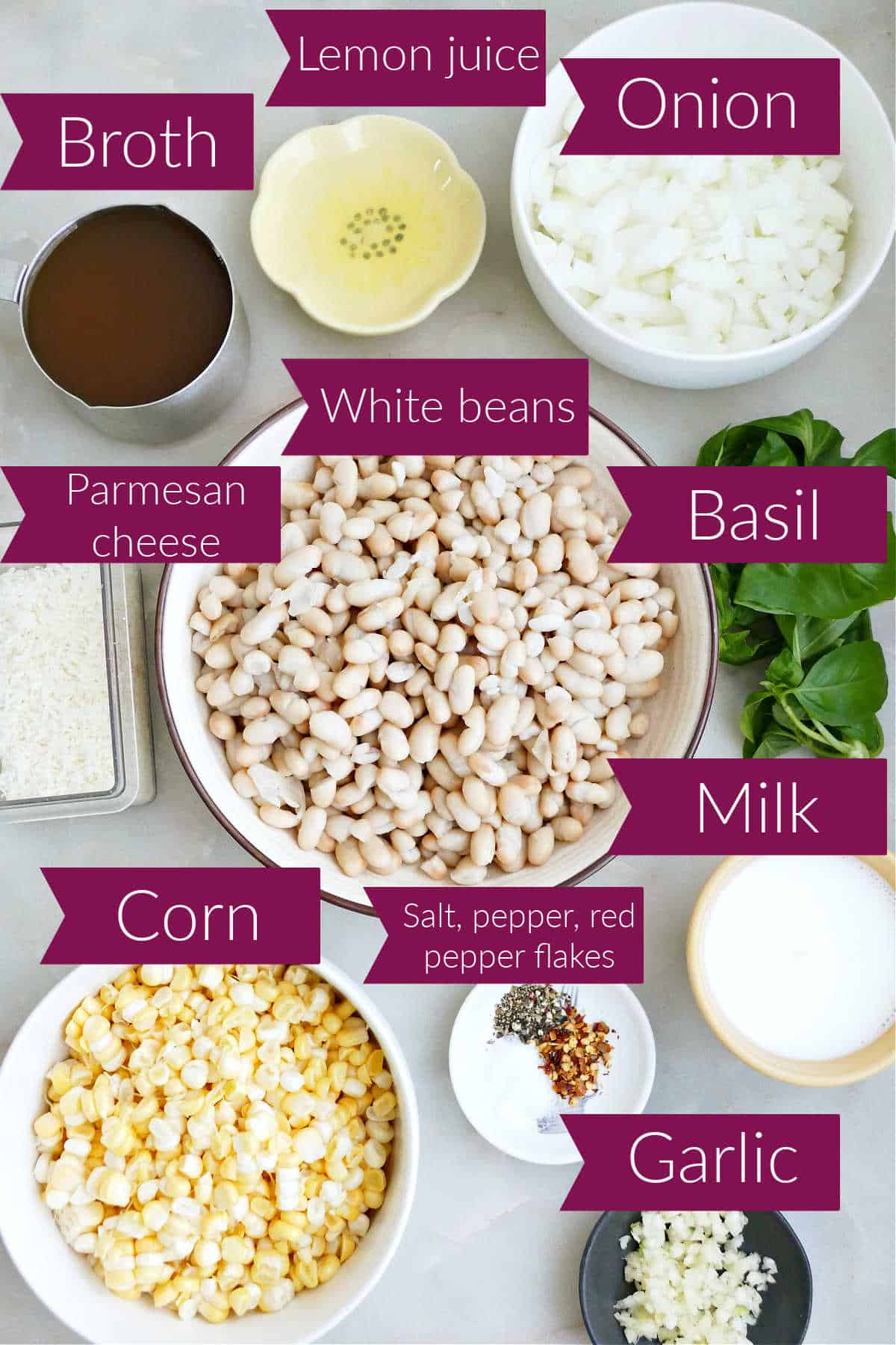 Broth, lemon juice, onion, basil, beans, cheese, corn, seasonings, milk, and garlic with labels.