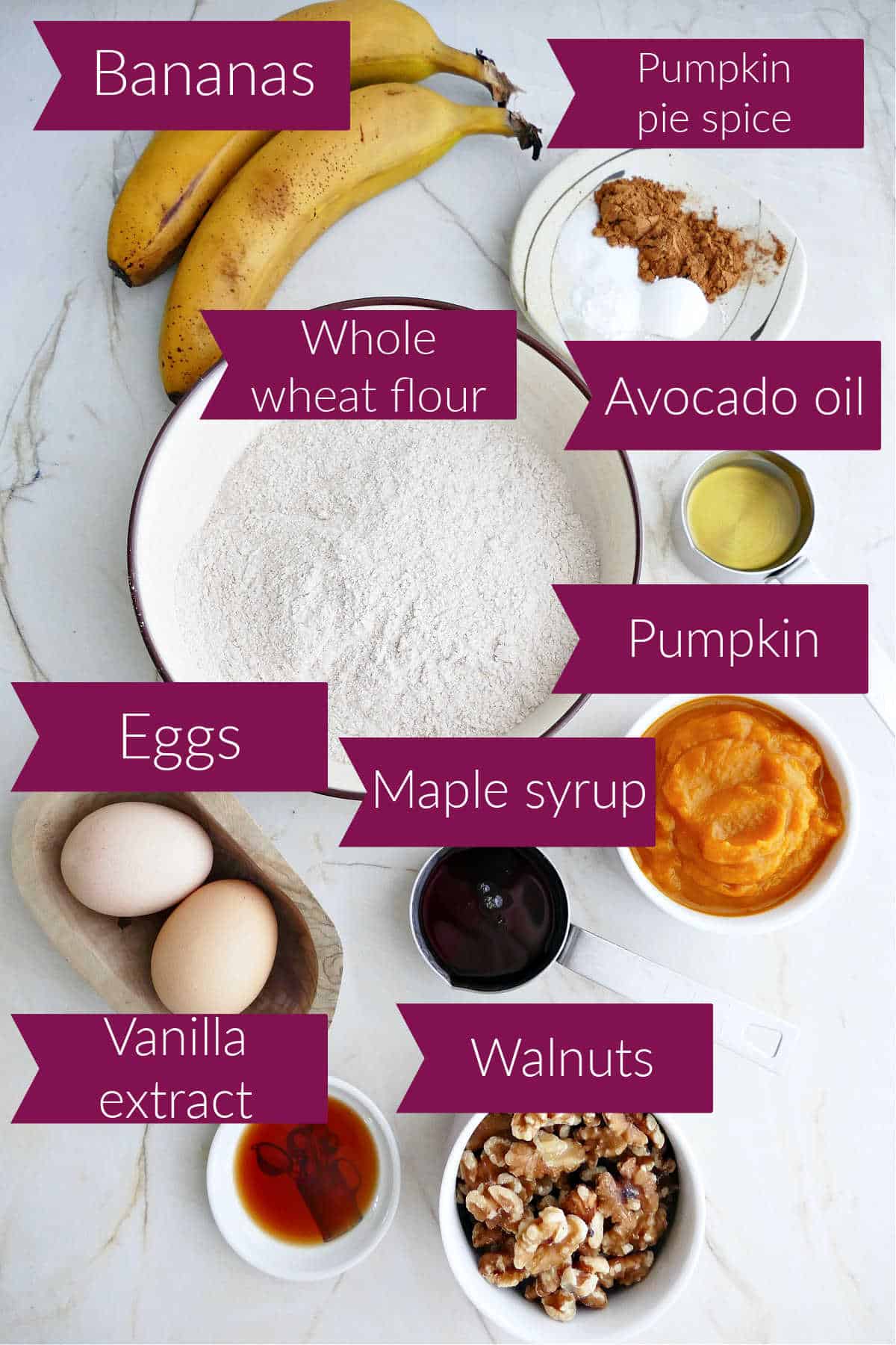 Bananas, spices, flour, oil, pumpkin, maple syrup, walnuts, vanilla, and eggs with labels.