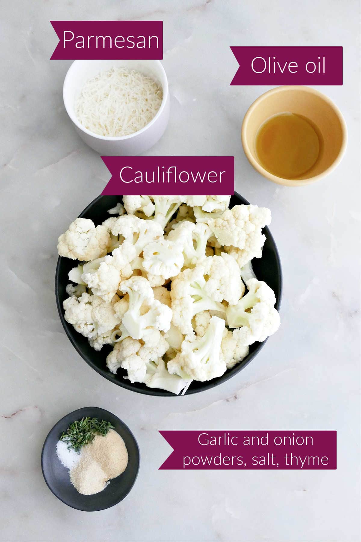 Parmesan cheese, olive oil, cauliflower florets, and seasonings in bowls with labels.