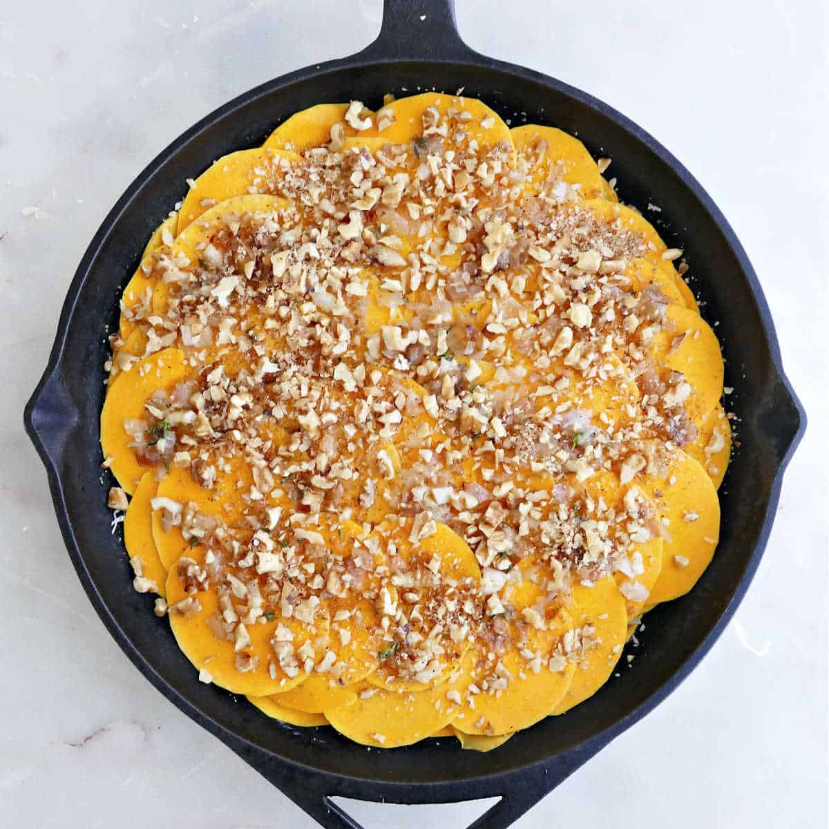 Squash slices sprinkled with walnut and brown sugar crumble.
