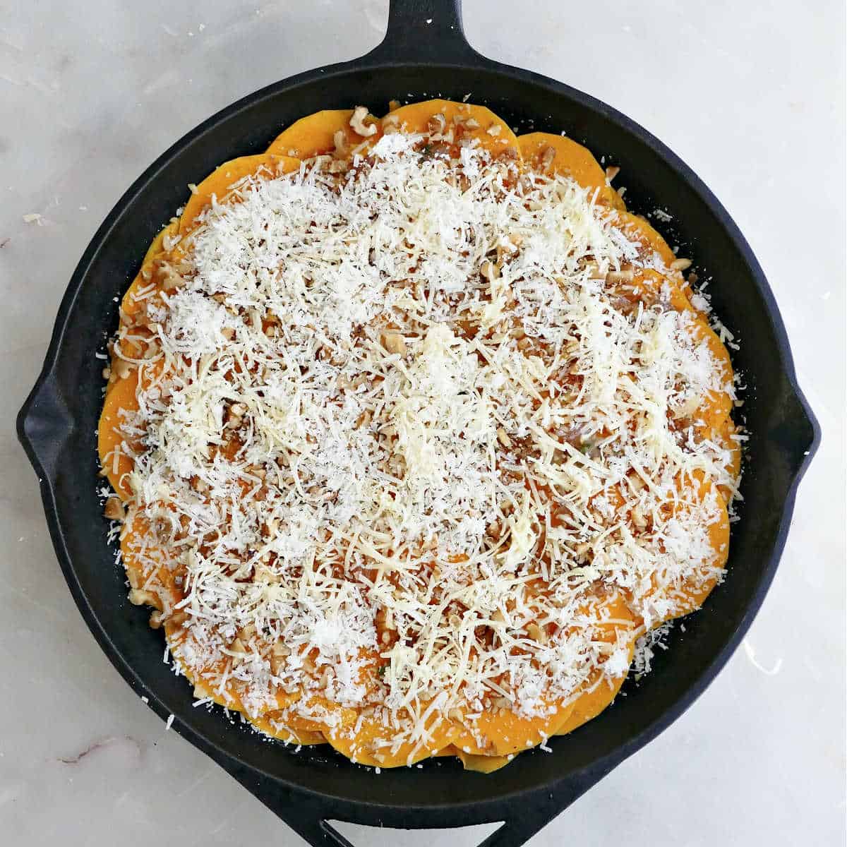 Squash gratin sprinkled with gruyere and parmesan cheeses.