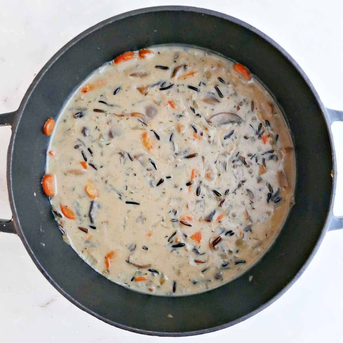 Cream of mushroom wild rice soup in a pot after cooking.