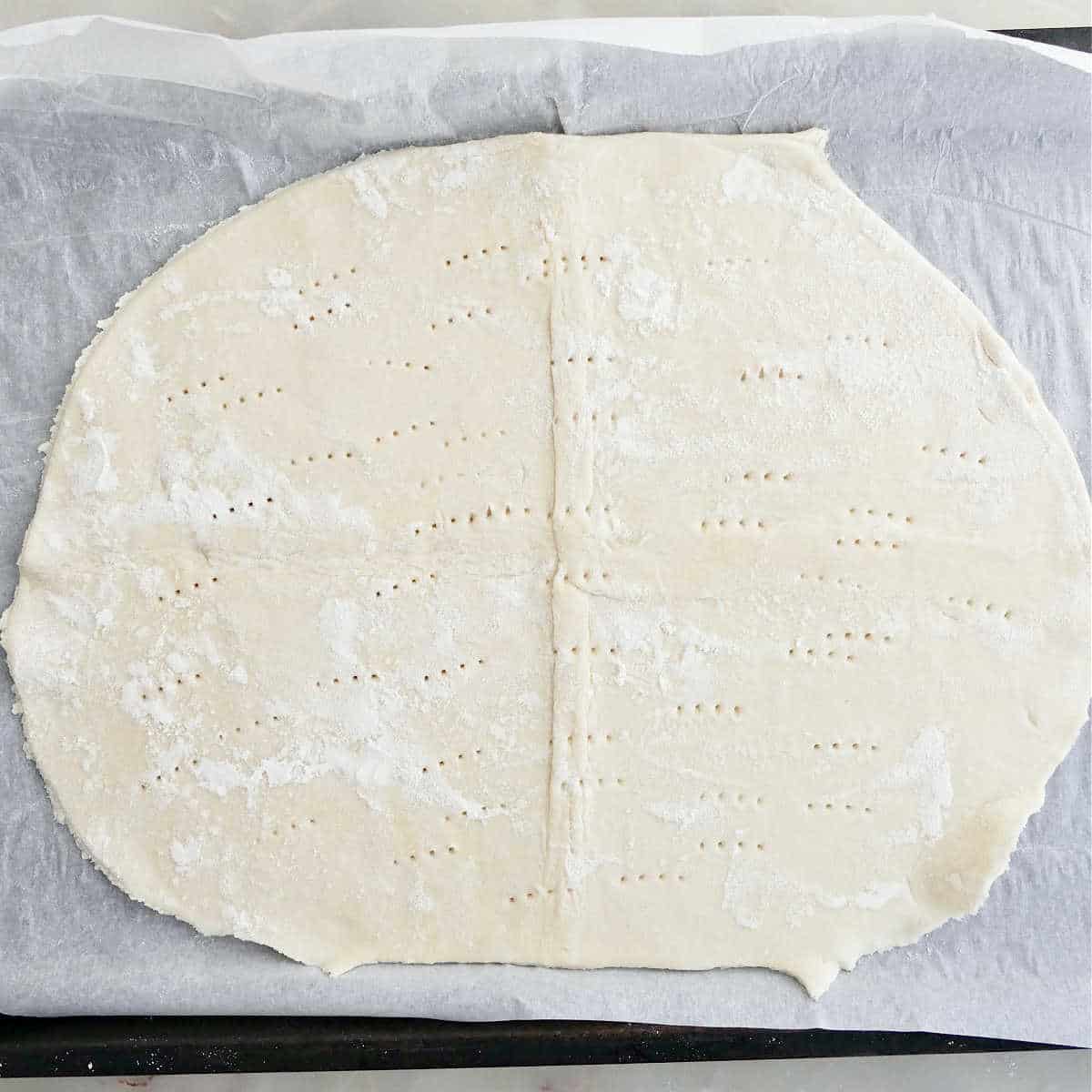 Puff pastry docked with a fork several times.