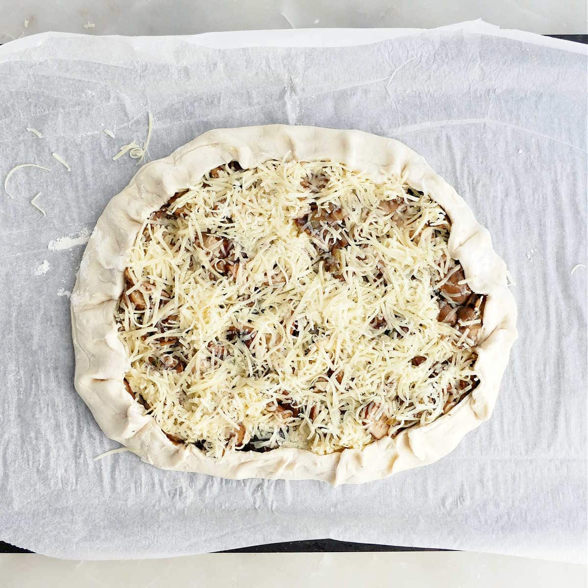 Puff pastry with edges folded in to make a galette.