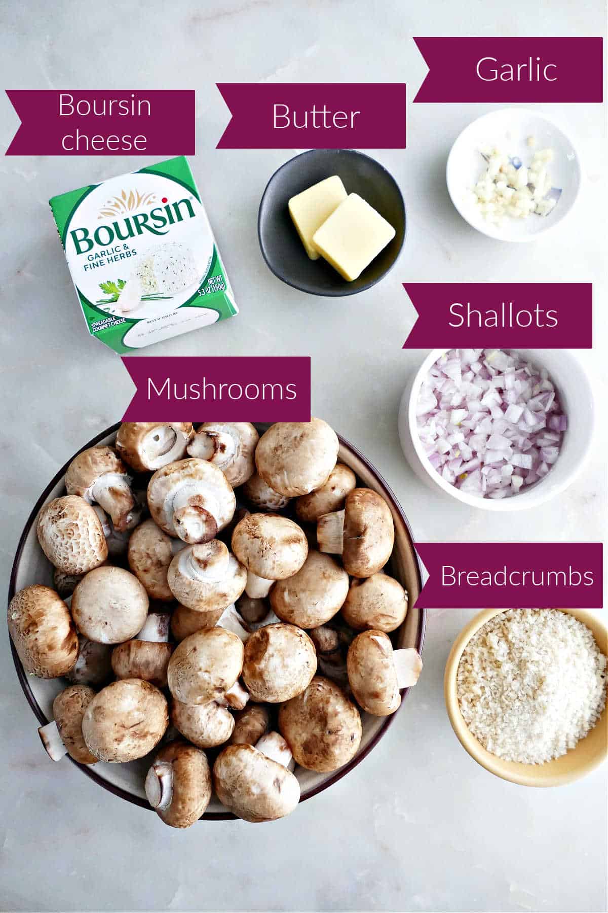 Boursin cheese, butter, garlic, mushrooms, shallots, and breadcrumbs on a counter with labels.