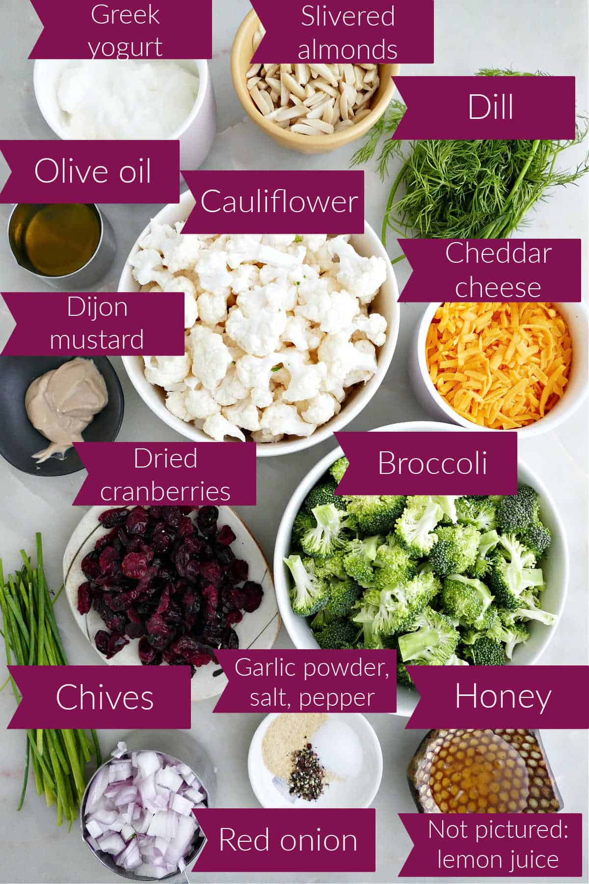 Greek yogurt, almonds, oil, mustard, cauliflower, dill, cheddar, dried cranberries, broccoli, chives, shallot, spices, and honey.