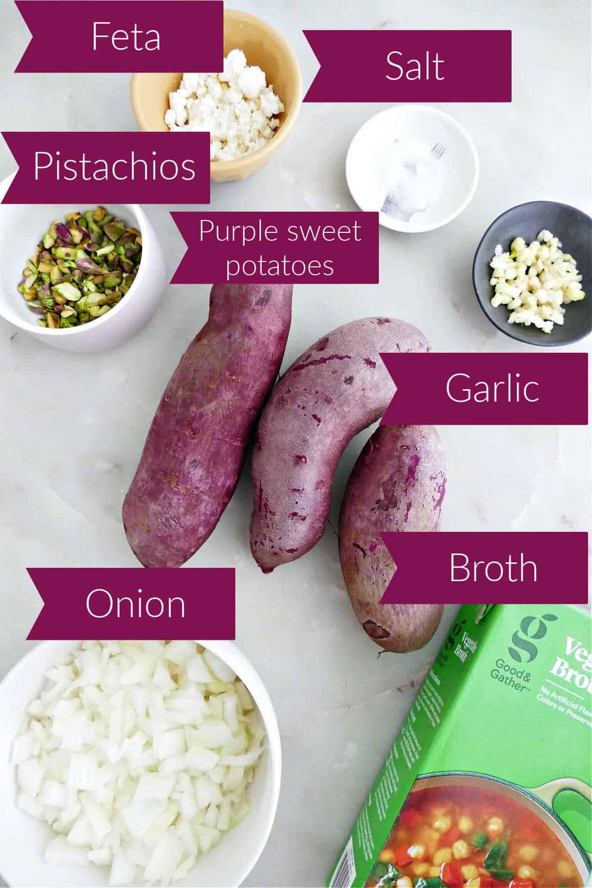 Pistachios, feta, salt, purple sweet potatoes, garlic, onion, and broth on a counter with labels.