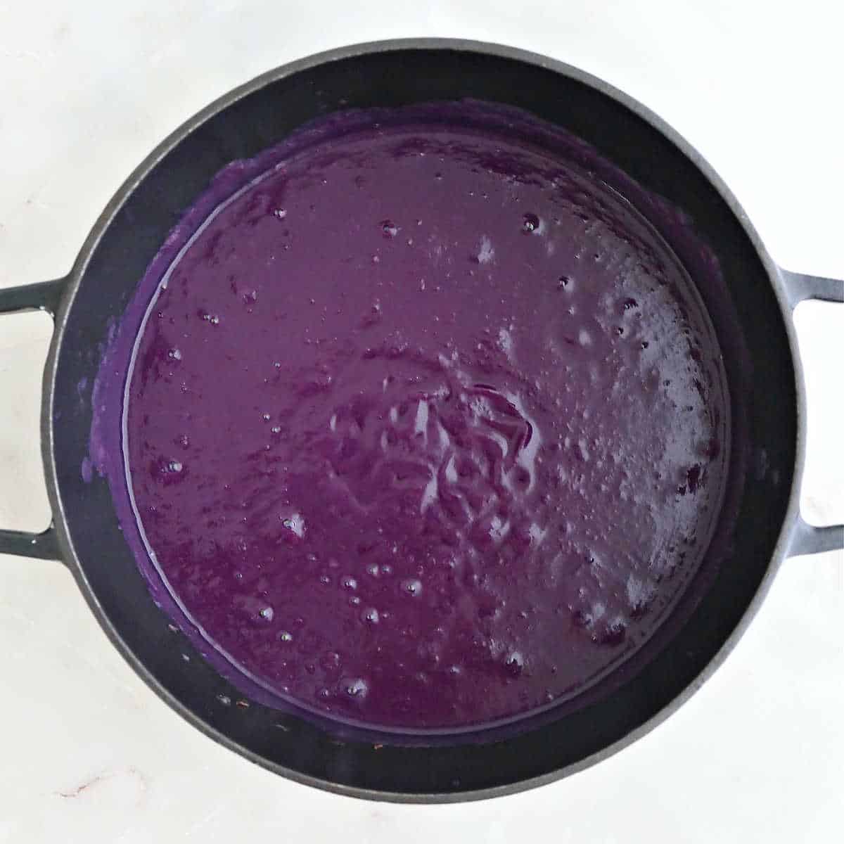 Purple sweet potato soup in a pot after being blended.