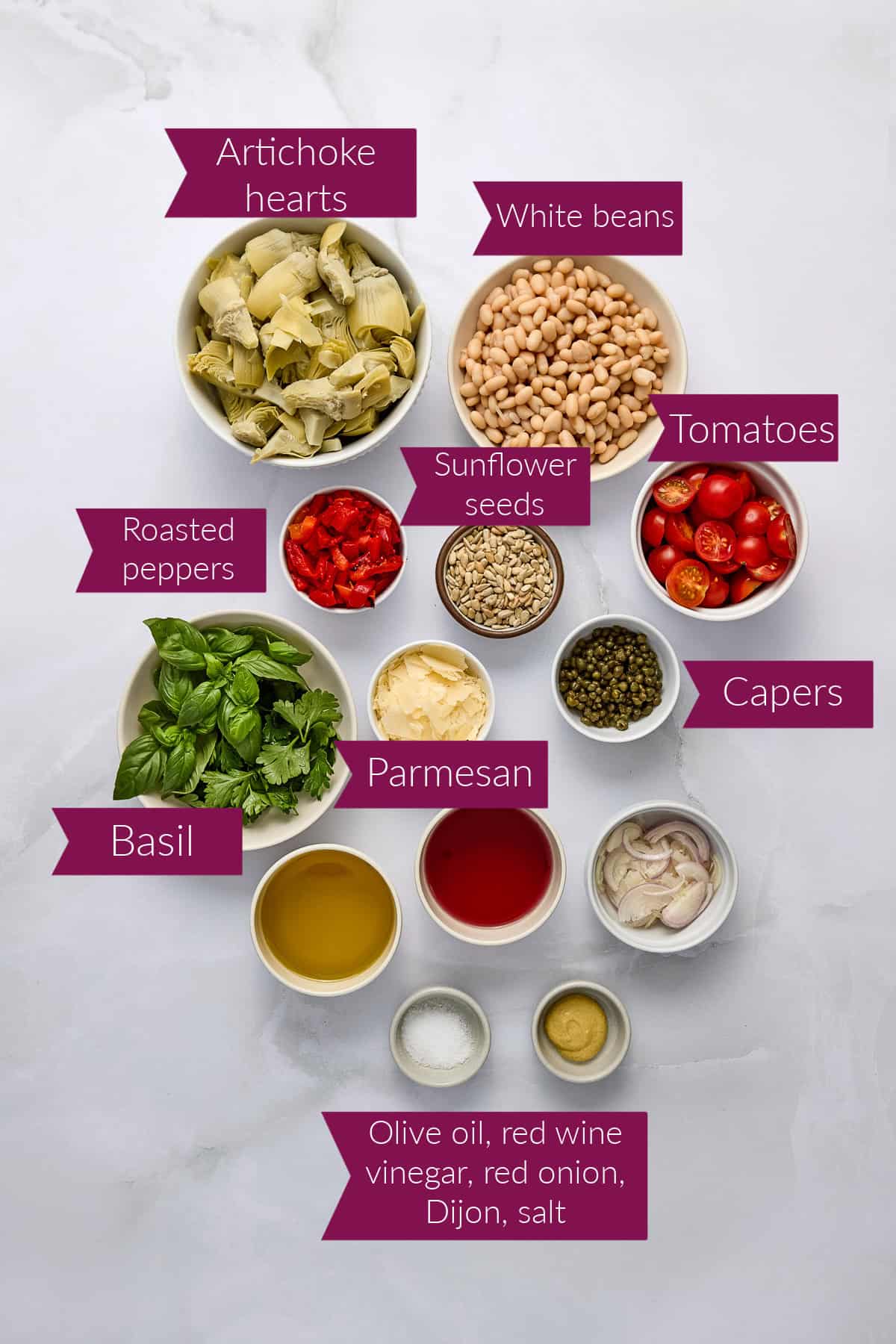 Artichoke hearts, white beans, peppers, sunflower seeds, herbs, parmesan, capers, oil, vinegar, onion, salt, and mustard.