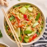 Bok choy stir fry in a bowl with chopsticks on the side.
