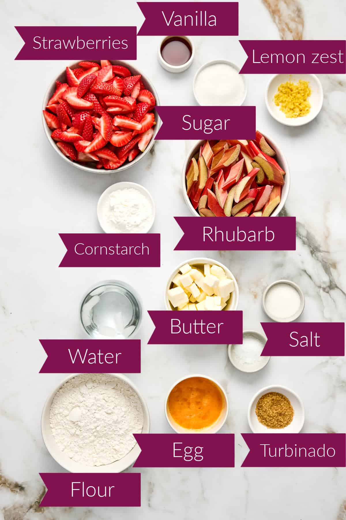 Strawberries, sugar, lemon zest, cornstarch, rhubarb, water, butter, salt, flour, egg, and turbinado in bowls.