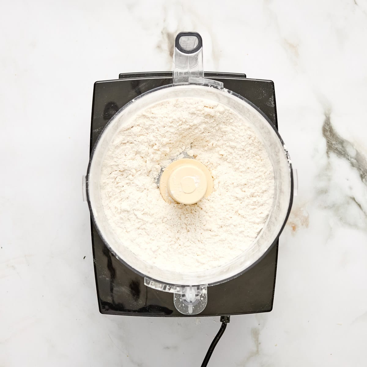 Ingredients for galette dough in a food processor.