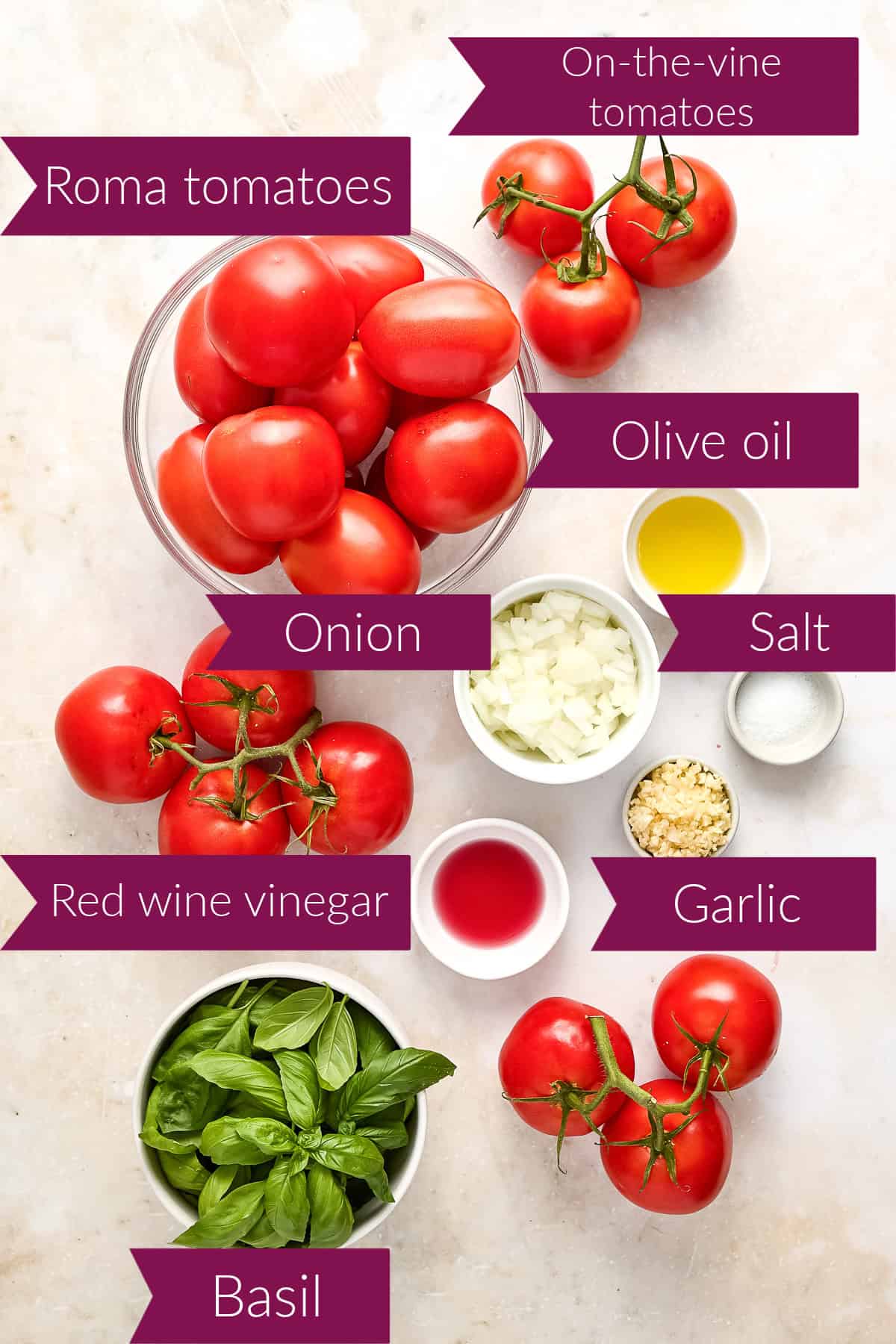 Fresh tomatoes, olive oil, onion, garlic, salt, red wine vinegar, and basil with labels.