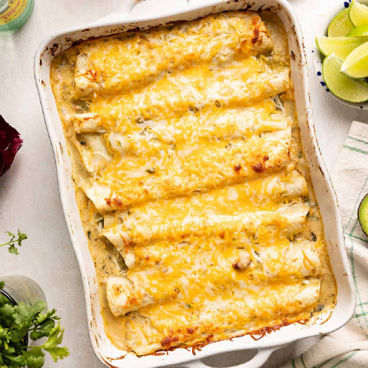 Vegetarian enchiladas in a baking dish after coming out of the oven.